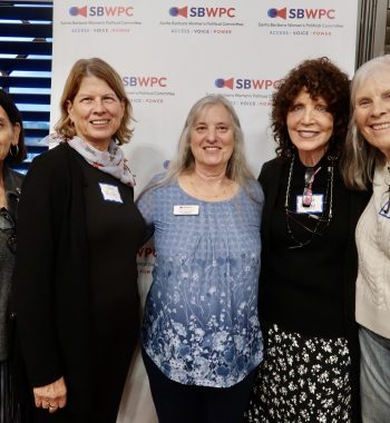 People smiling at the Cosmopolitics 2025 event